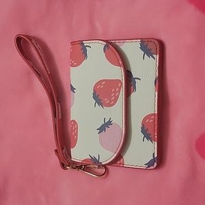 Claire's small strawberry Wristlet.  White with red and pink strawberries.